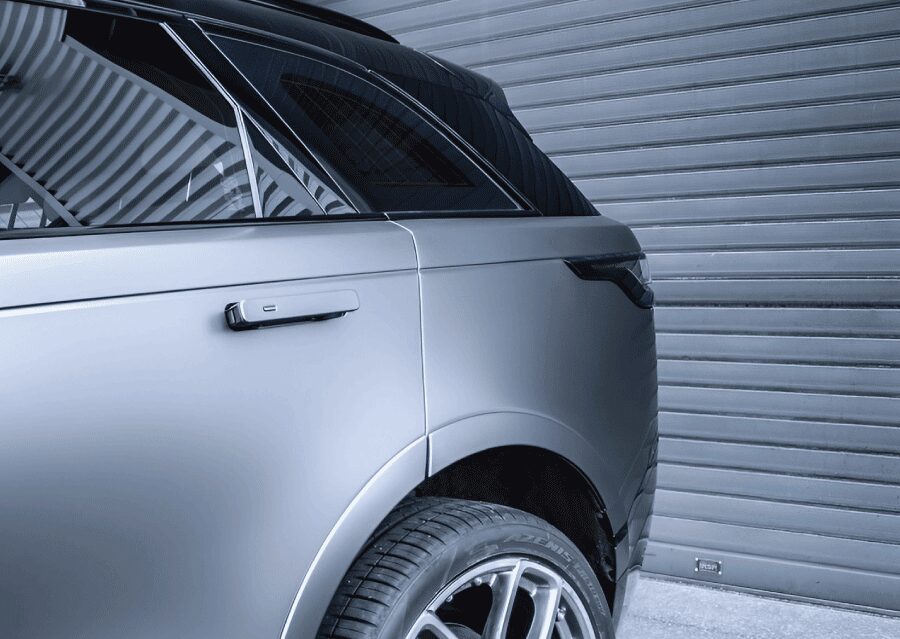 The rear of a Range Rover wrapped in a satin gun metal grey by TintBusiness